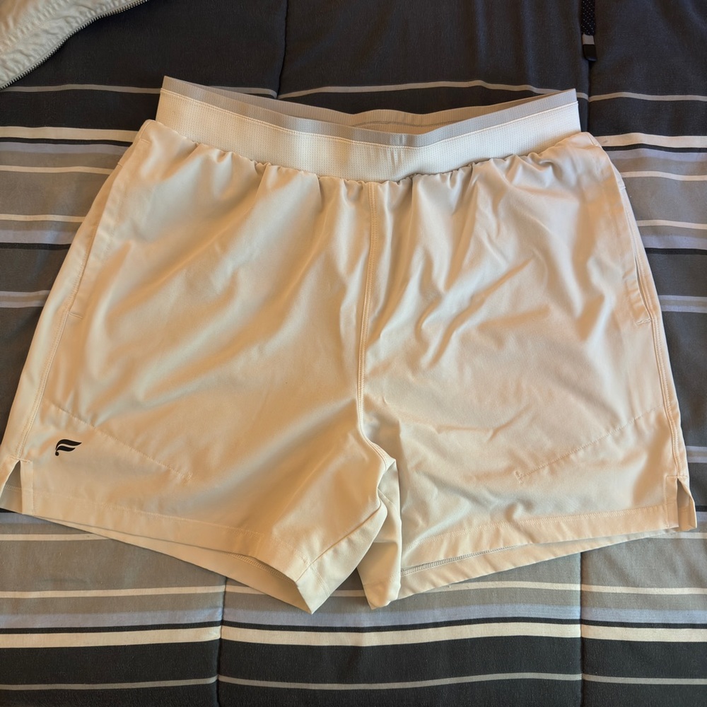 White training shorts with built in compression shorts